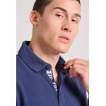 Polo μπλούζα με branded τύπωμα στην εσωτερική πατι