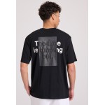 Relaxed fit t-shirt με embossed τύπωμα στην πλάτη
