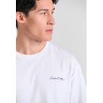 Relaxed fit t-shirt με graphic τύπωμα στην πλάτη Relaxed fit t-shirt με graphic τύπωμα στην πλάτη